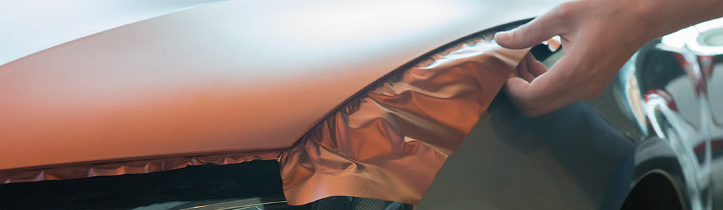 Pasting of car carbonic plastic closeup.