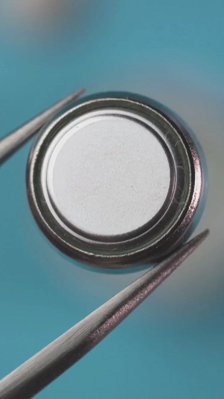 Button cell battery made with Silver Oxide.